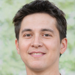 Joyful white young-adult male with short  brown hair and brown eyes