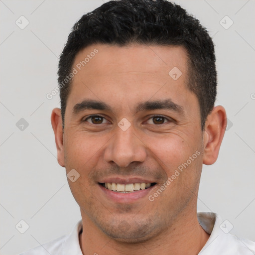 Joyful white young-adult male with short  black hair and brown eyes