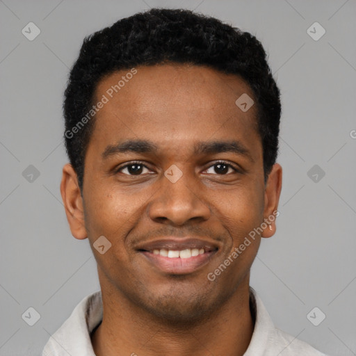 Joyful black young-adult male with short  black hair and brown eyes