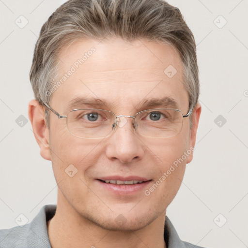 Joyful white adult male with short  brown hair and grey eyes