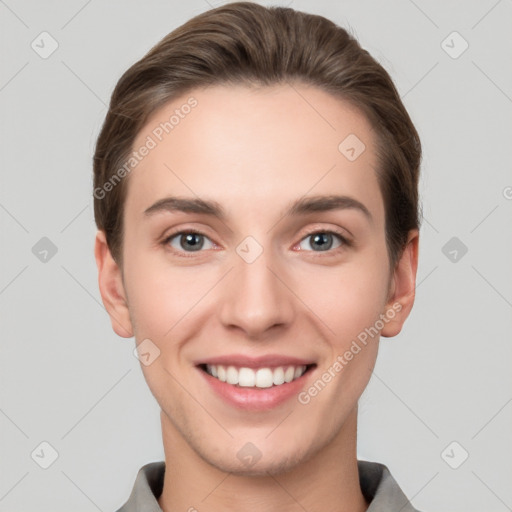 Joyful white young-adult female with short  brown hair and grey eyes