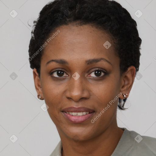 Joyful black young-adult female with short  black hair and brown eyes