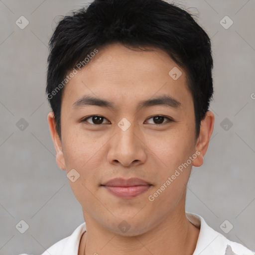 Joyful asian young-adult male with short  black hair and brown eyes