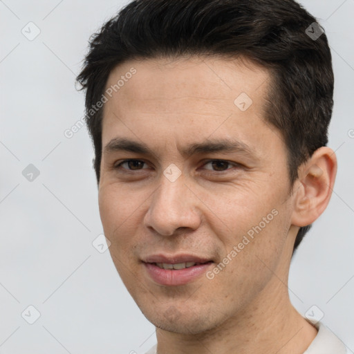 Joyful white adult male with short  brown hair and brown eyes