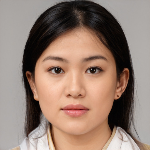 Neutral white young-adult female with medium  brown hair and brown eyes