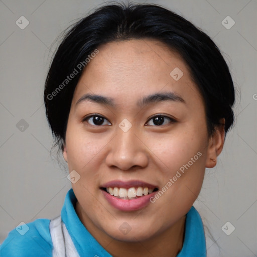 Joyful asian young-adult female with medium  black hair and brown eyes