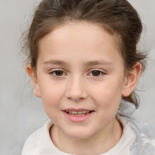 Joyful white child female with medium  brown hair and brown eyes