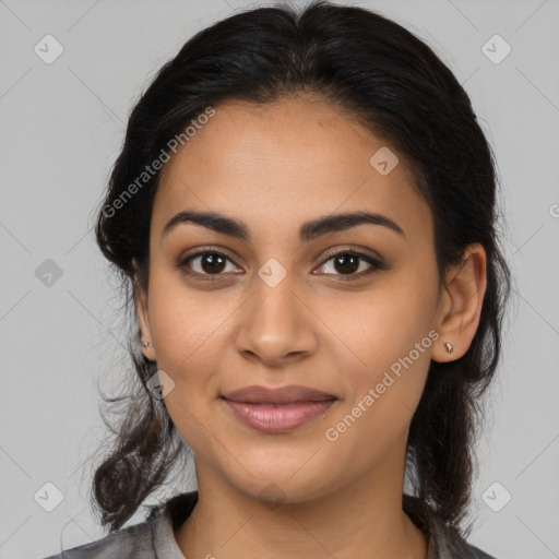 Joyful latino young-adult female with medium  brown hair and brown eyes