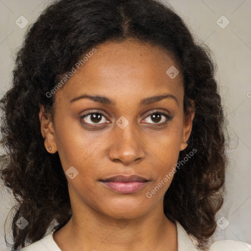 Joyful black young-adult female with medium  brown hair and brown eyes