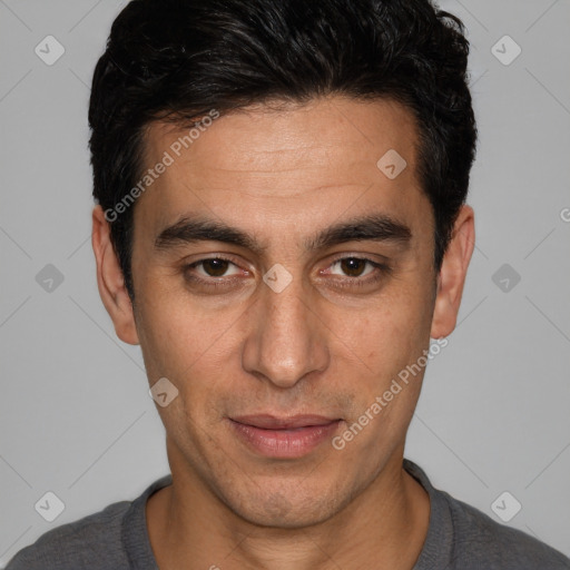 Joyful white young-adult male with short  black hair and brown eyes