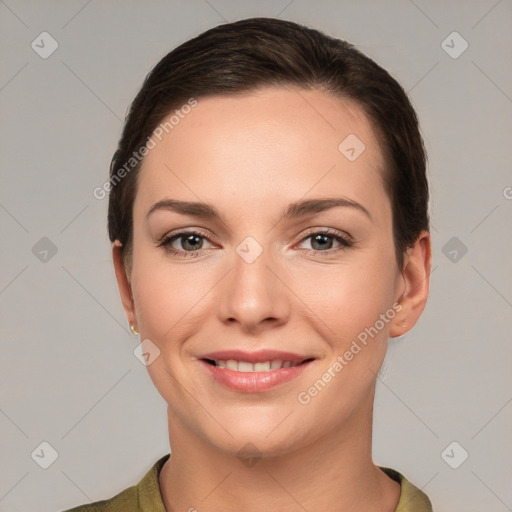 Joyful white young-adult female with short  brown hair and grey eyes