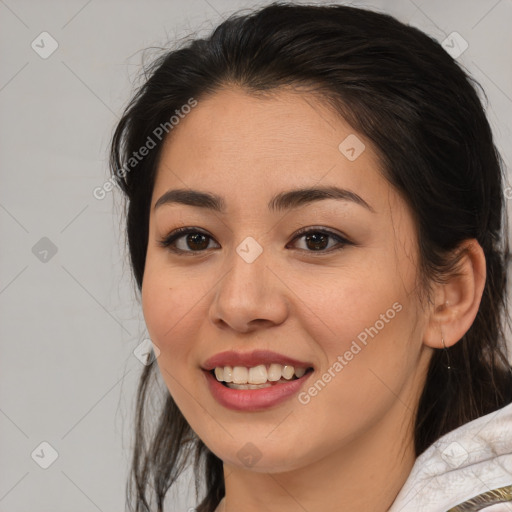 Joyful latino young-adult female with medium  brown hair and brown eyes