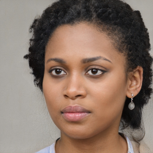 Neutral black young-adult female with long  black hair and brown eyes