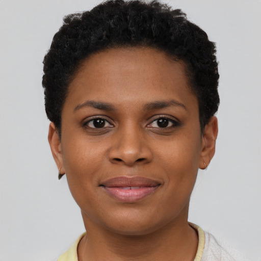 Joyful black young-adult female with short  brown hair and brown eyes
