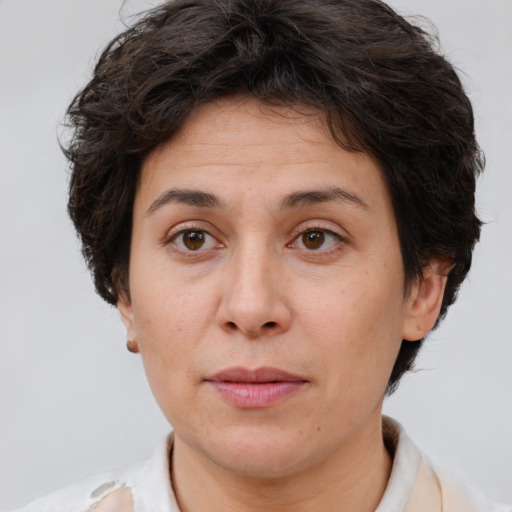 Joyful white adult female with short  brown hair and brown eyes