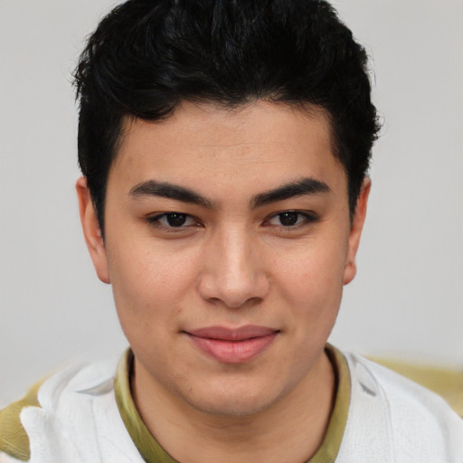 Joyful latino young-adult male with short  brown hair and brown eyes