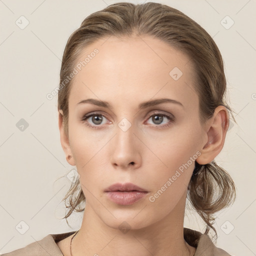 Neutral white young-adult female with medium  brown hair and grey eyes