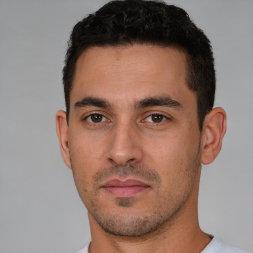 Neutral white young-adult male with short  black hair and brown eyes