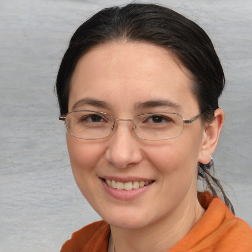 Joyful white adult female with short  brown hair and brown eyes