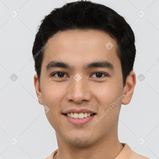 Joyful white young-adult male with short  black hair and brown eyes