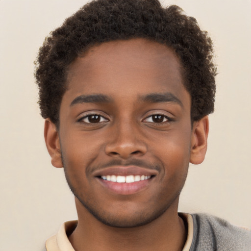 Joyful black young-adult male with short  brown hair and brown eyes