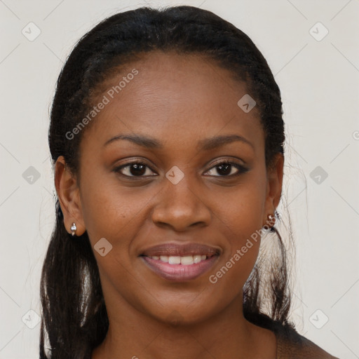 Joyful black young-adult female with long  brown hair and brown eyes