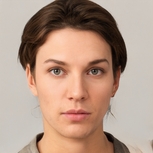 Neutral white young-adult female with medium  brown hair and grey eyes