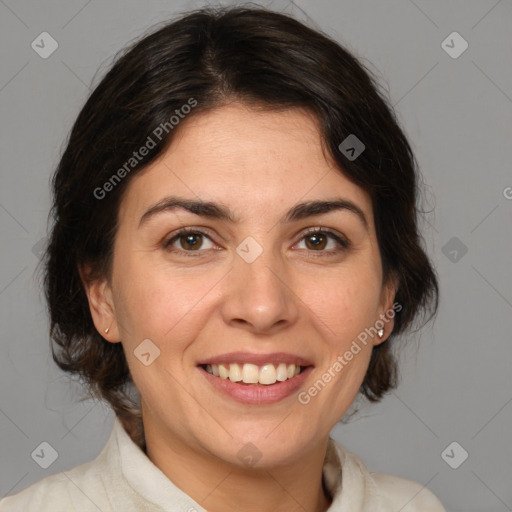 Joyful white adult female with medium  brown hair and brown eyes