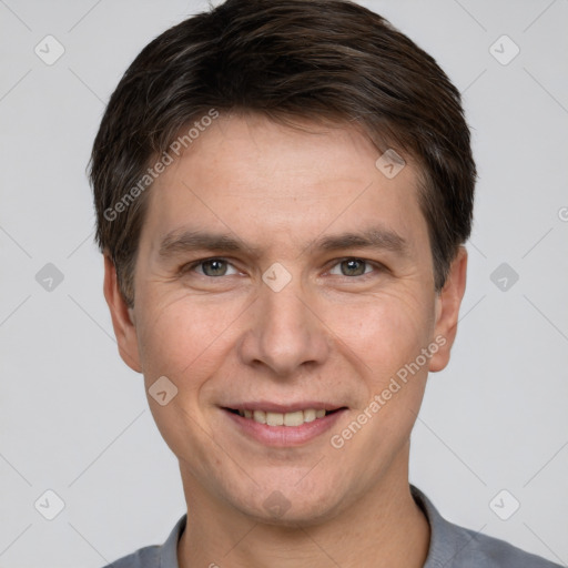 Joyful white adult male with short  brown hair and brown eyes