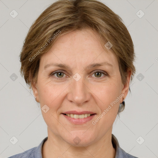 Joyful white adult female with medium  brown hair and grey eyes