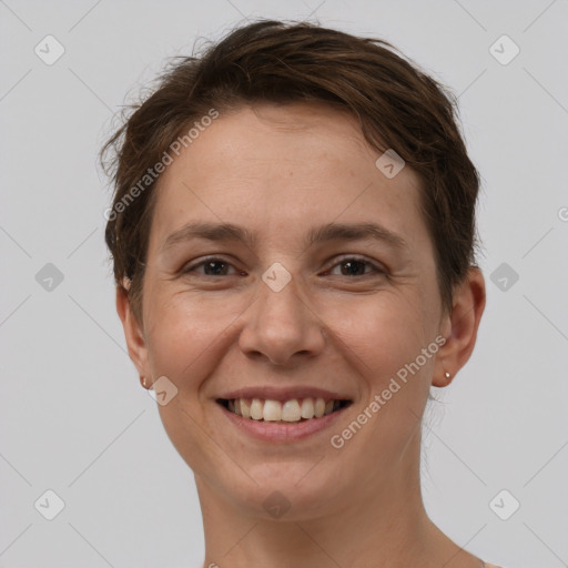 Joyful white adult female with short  brown hair and brown eyes