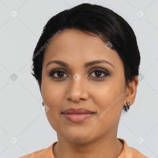 Joyful latino young-adult female with short  black hair and brown eyes