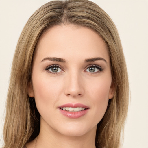 Joyful white young-adult female with long  brown hair and green eyes