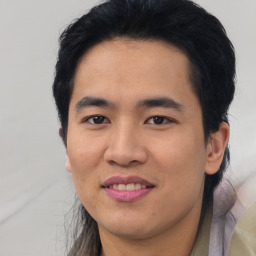Joyful asian young-adult male with short  brown hair and brown eyes