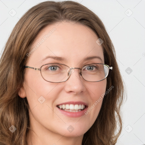 Joyful white young-adult female with long  brown hair and green eyes