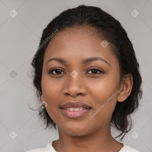 Joyful black young-adult female with medium  black hair and brown eyes