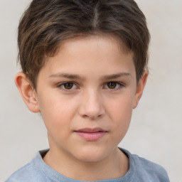 Joyful white child male with short  brown hair and brown eyes