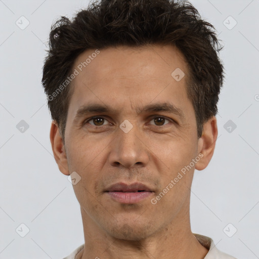 Joyful white adult male with short  brown hair and brown eyes