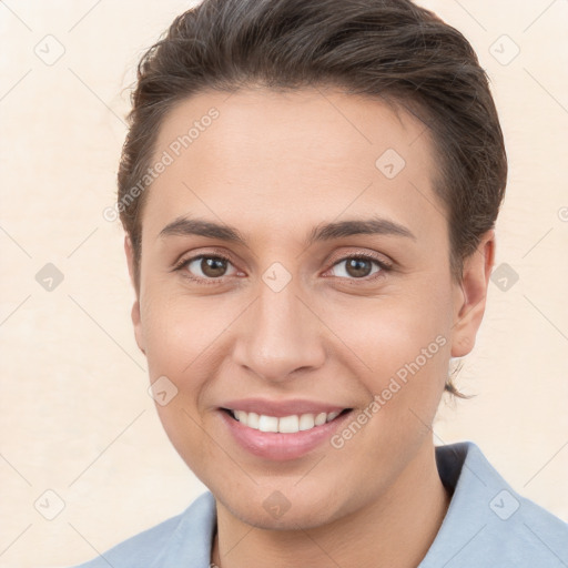 Joyful white young-adult female with short  brown hair and brown eyes