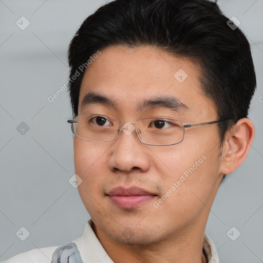 Joyful asian young-adult male with short  brown hair and brown eyes