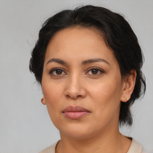 Neutral latino young-adult female with medium  brown hair and brown eyes