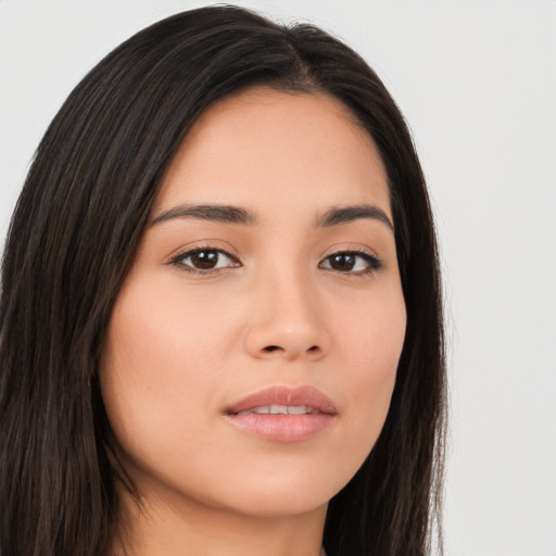 Joyful asian young-adult female with long  brown hair and brown eyes