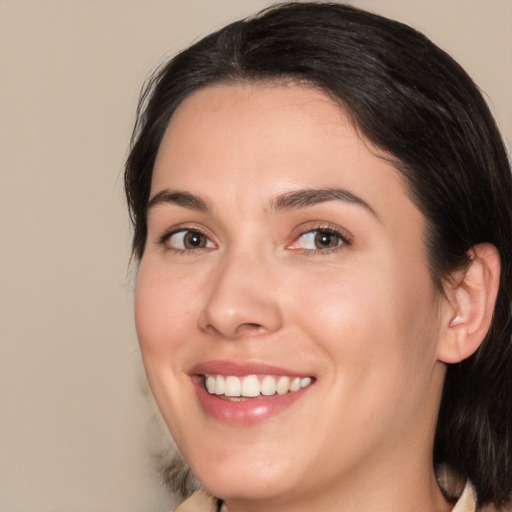 Joyful white young-adult female with medium  brown hair and brown eyes