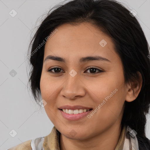 Joyful latino young-adult female with long  brown hair and brown eyes