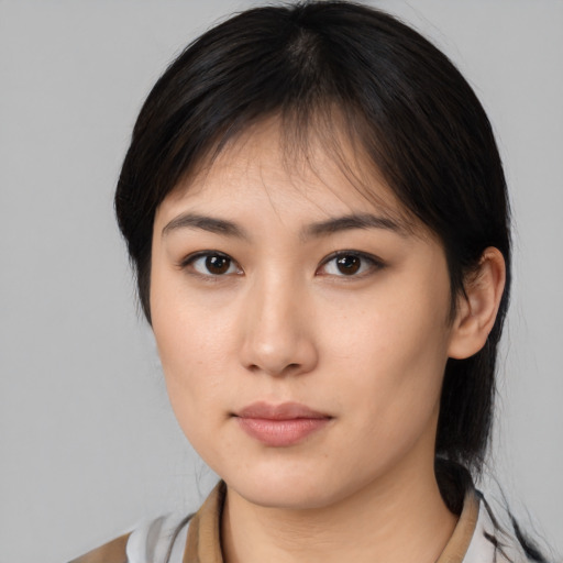 Neutral asian young-adult female with medium  brown hair and brown eyes