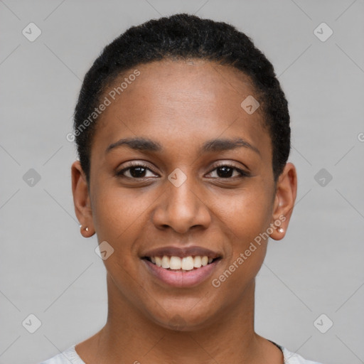 Joyful black young-adult female with short  black hair and brown eyes