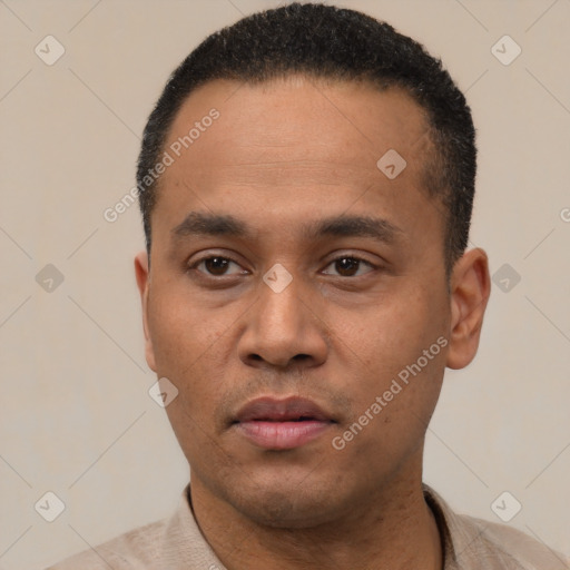 Neutral latino young-adult male with short  black hair and brown eyes