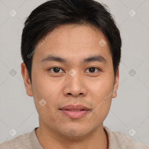 Joyful asian young-adult male with short  brown hair and brown eyes