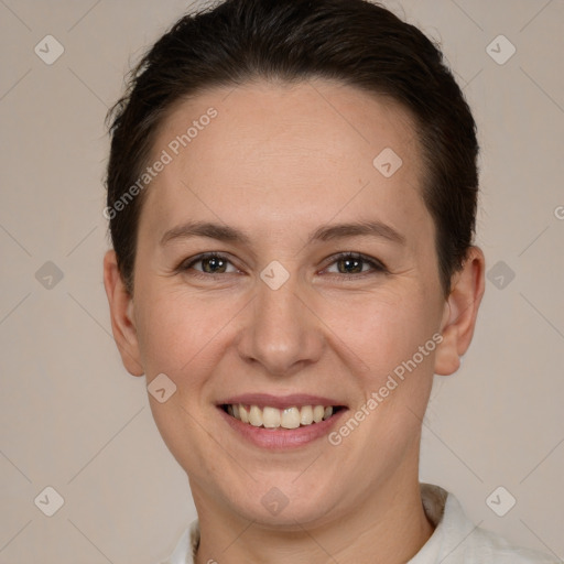 Joyful white adult female with short  brown hair and brown eyes