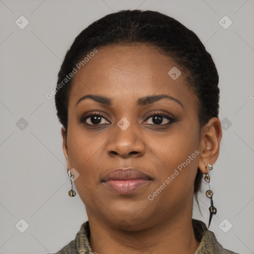 Joyful black young-adult female with short  black hair and brown eyes